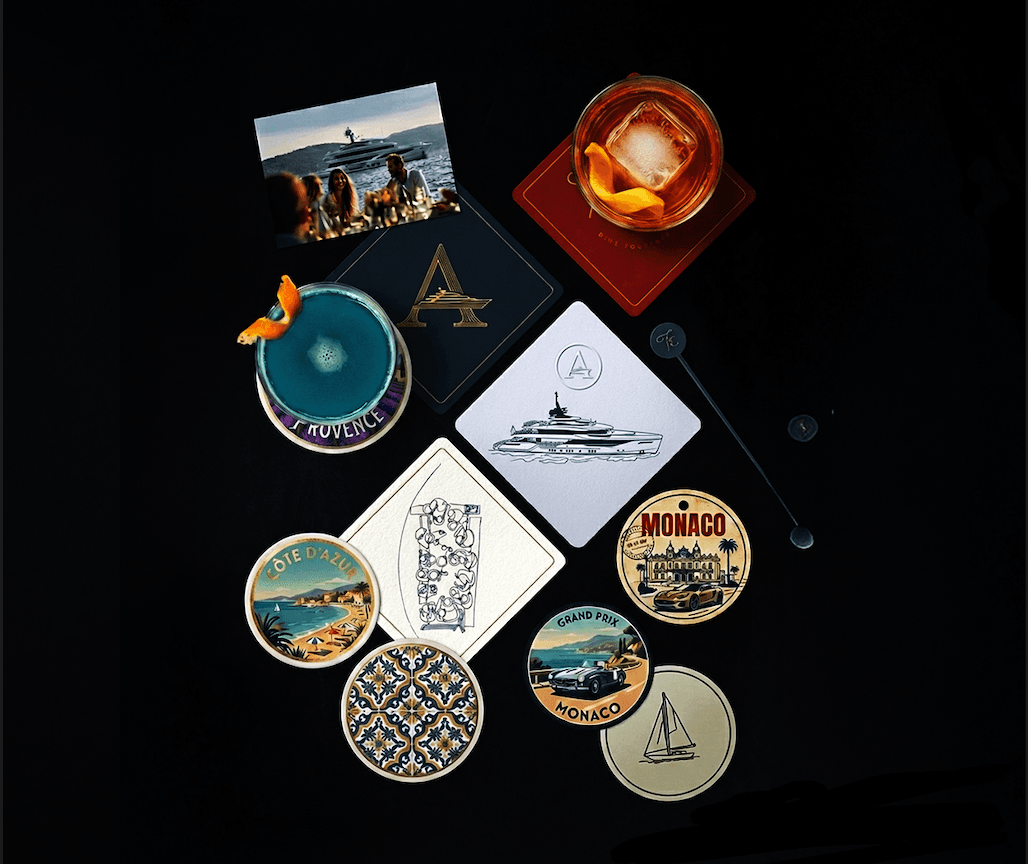 Armada Club brand collateral, coasters, cocktails, and yacht imagery